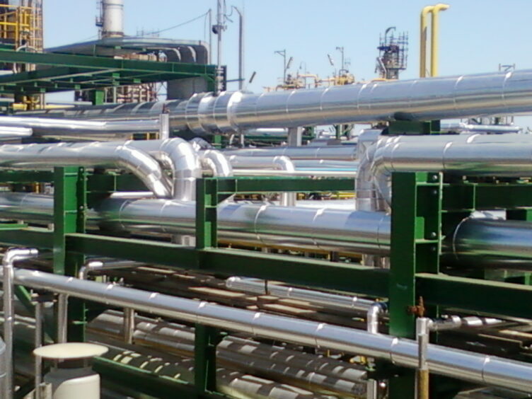 Insulated and clad industrial process pipework across a process plant